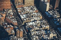 Aerial view of a New York City neighborhood with apartment buildings and street traffic. Original public domain image from <a href="https://commons.wikimedia.org/wiki/File:A_few_of_New_York%27s_shorter_buildings_(Unsplash).jpg" target="_blank" rel="noopener noreferrer nofollow">Wikimedia Commons</a>
