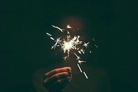 Person holding a lighted sparkler. Original public domain image from <a href="https://commons.wikimedia.org/wiki/File:Sheffield,_United_Kingdom_(Unsplash_wd3Y2YgdjPk).jpg" target="_blank">Wikimedia Commons</a>