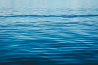 Ripples on the blue surface of a body of water. Original public domain image from Wikimedia Commons