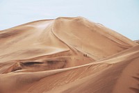 People take an extreme hike through the hot terrain of Namib Desert. Original public domain image from Wikimedia Commons