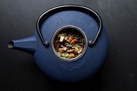 Overhead view of a blue kettle teapot filled with herbs at Laguna Beach. Original public domain image from Wikimedia Commons