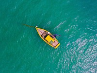 Yellow boat on the ocean.  Original public domain image from <a href="https://commons.wikimedia.org/wiki/File:Last_pic_of_2016_(Unsplash).jpg" target="_blank">Wikimedia Commons</a>