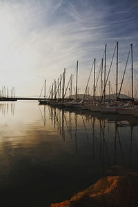 Aligned sail boats near the dock. Original public domain image from <a href="https://commons.wikimedia.org/wiki/File:Marta_Pawlik_2015-04-08_(Unsplash).jpg" target="_blank">Wikimedia Commons</a>