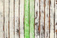 A worn out wooden deck with two green slats in the middle. Original public domain image from Wikimedia Commons