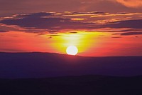 A red and orange sunset with the hills on the horizon in silhouette at Elizabeth Lookout.. Original public domain image from <a href="https://commons.wikimedia.org/wiki/File:My_Sunset_(Unsplash).jpg" target="_blank" rel="noopener noreferrer nofollow">Wikimedia Commons</a>