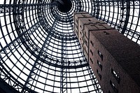 Low angle of gray concrete tower. Original public domain image from <a href="https://commons.wikimedia.org/wiki/File:Melbourne,_Australia_(Unsplash_4NJoYCuWDok).jpg" target="_blank">Wikimedia Commons</a>