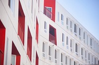 White and red concrete building. Original public domain image from Wikimedia Commons