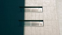 Concrete building with horizontal windows half in shadow. Original public domain image from <a href="https://commons.wikimedia.org/wiki/File:Go_back_to_the_shadow_(Unsplash).jpg" target="_blank" rel="noopener noreferrer nofollow">Wikimedia Commons</a>