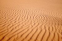 Wind forms ripple patterns in the sand of the Sahara Desert. Original public domain image from Wikimedia Commons