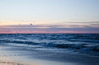 Busy waves in the ocean of Karwia beach with looming sunrise. Original public domain image from <a href="https://commons.wikimedia.org/wiki/File:Ocean_waves_at_Karwia_beach_(Unsplash).jpg" target="_blank" rel="noopener noreferrer nofollow">Wikimedia Commons</a>