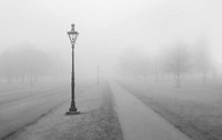 Foggy view of a walking path and streetlight in the winter. Original public domain image from Wikimedia Commons
