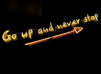 A yellow “Go up and never stop” neon with a long arrow against a black background. Original public domain image from Wikimedia Commons