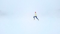 A person running in the snow during a whiteout. Original public domain image from Wikimedia Commons