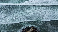 Sea waves with white foam, pebble stones. Original public domain image from <a href="https://commons.wikimedia.org/wiki/File:Stefany_Gonzales_2017_(Unsplash).jpg" target="_blank">Wikimedia Commons</a>