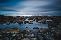 Rocky shore of the ocean. Original public domain image from Wikimedia Commons