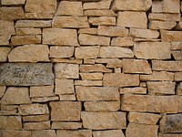 A stone rock wall. Original public domain image from Wikimedia Commons