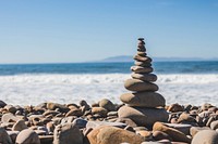 Stone balancing with pebble tower on the Ventura rocky beach. Original public domain image from Wikimedia Commons