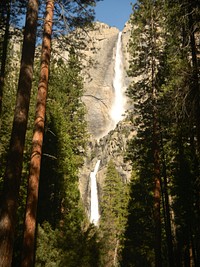 A look up at a waterfall pouring down a rocky mountain in Yosemite National Park. Original public domain image from Wikimedia Commons
