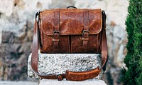 Brown leather bag. Original public domain image from <a href="https://commons.wikimedia.org/wiki/File:%C3%81lvaro_Serrano_2016-09-06_(Unsplash_pFLNV4gkXsc).jpg" target="_blank">Wikimedia Commons</a>