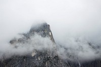 Rocky mountain peak in Yosemite on a foggy day. Original public domain image from <a href="https://commons.wikimedia.org/wiki/File:Yosemite_National_Park_in_Fog_(Unsplash).jpg" target="_blank" rel="noopener noreferrer nofollow">Wikimedia Commons</a>