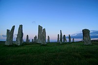 Several stones standing upright in the grass. Original public domain image from Wikimedia Commons