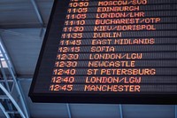 A low-angle shot of a departure board at an airport. Original public domain image from Wikimedia Commons