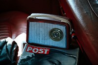 Radio and magazine on the seat of the vintage car.. Original public domain image from <a href="https://commons.wikimedia.org/wiki/File:Interior_vintage_car._(Unsplash).jpg" target="_blank" rel="noopener noreferrer nofollow">Wikimedia Commons</a>