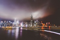 City skyline on the waterfront downtown on a foggy night. Original public domain image from Wikimedia Commons