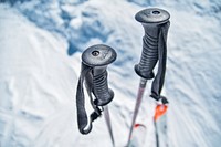 Ski sticks in snow. Original public domain image from <a href="https://commons.wikimedia.org/wiki/File:Val_Thorens,_France_(Unsplash_RCF-_l7vITo).jpg" target="_blank">Wikimedia Commons</a>