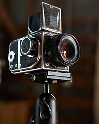 Camera on tripod. Original public domain image from Wikimedia Commons