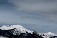Icy mountaintops with cloudy skies behind. Original public domain image from <a href="https://commons.wikimedia.org/wiki/File:Icy_Mountains_(Unsplash).jpg" target="_blank" rel="noopener noreferrer nofollow">Wikimedia Commons</a>