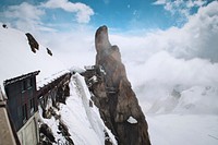 An angular shot of an observation platform on a snowy mountainside in Aiguille du Midi. Original public domain image from Wikimedia Commons