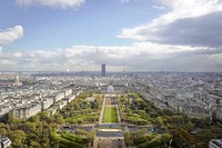 Aerial drone view of the Paris skyline from Eiffel Tower on a cloudy day.. Original public domain image from Wikimedia Commons