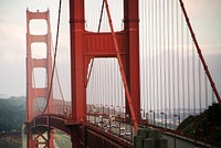 Traffic drives over Golden Gate Bridge. Original public domain image from <a href="https://commons.wikimedia.org/wiki/File:Golden_Gate_Bridge_(Unsplash_CyQj1E6gOhw).jpg" target="_blank" rel="noopener noreferrer nofollow">Wikimedia Commons</a>