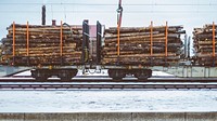 Train with logs. Original public domain image from <a href="https://commons.wikimedia.org/wiki/File:Ljusdal,_Sweden_(Unsplash_UsET4S0ginw).jpg" target="_blank">Wikimedia Commons</a>