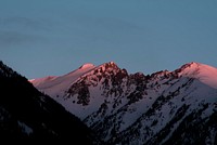 Shadow falling over a mountain ridge during sunset in Silverthorne. Original public domain image from Wikimedia Commons