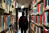 Man in library. Original public domain image from Wikimedia Commons