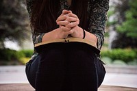 Woman praying with a bible. Original public domain image from <a href="https://commons.wikimedia.org/wiki/File:Olivia_Snow_2017-05-23_(Unsplash_CPPFtCHY6mo).jpg" target="_blank">Wikimedia Commons</a>