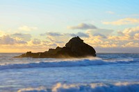 Waves around the ocean rock during sunset at Pfeiffer Beach. Original public domain image from Wikimedia Commons