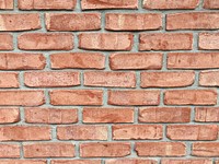 An orange brick wall. Original public domain image from Wikimedia Commons