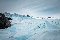 Snow drifts with mountain in the background. Original public domain image from Wikimedia Commons