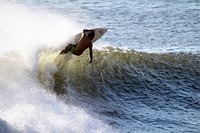 Surfing with waves in the sea. Original public domain image from Wikimedia Commons