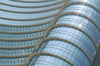 Curved glass facade of a modern building. Original public domain image from <a href="https://commons.wikimedia.org/wiki/File:Chris_Barbalis_2016-06-03_(Unsplash_WmBYAacmMgU).jpg" target="_blank" rel="noopener noreferrer nofollow">Wikimedia Commons</a>