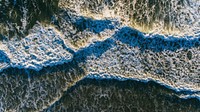 Drone view of ocean waves with foam washing on Ponte Vedra Beach, Florida, United States. Original public domain image from <a href="https://commons.wikimedia.org/wiki/File:Where_is_the_water_(Unsplash).jpg" target="_blank" rel="noopener noreferrer nofollow">Wikimedia Commons</a>