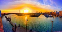 Boats docked at Brighton Marina, Brighton, United Kingdom. Original public domain image from Wikimedia Commons