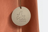 Label tag mockup, organic paper with bird logo for fashion business psd