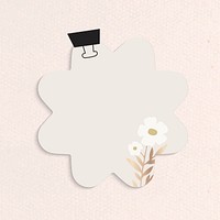 Blank flower shape notepaper set with binder clip on textured background