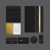 Set of golden geometric pattern on black surface stationery
