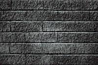 Dark gray brick textured background vector