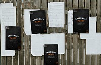 Black Halloween party poster templates on wooden background mockup